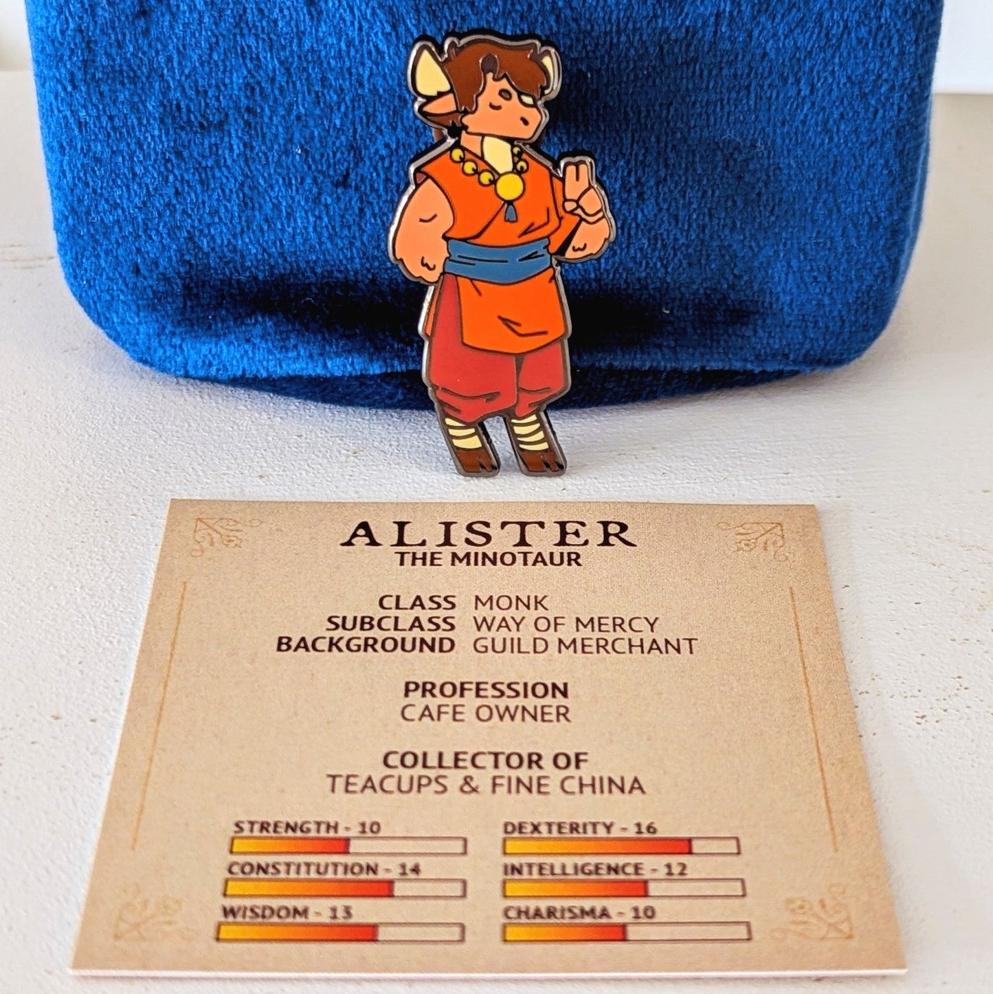 collectors guild cafe character pin with ttrpg stats card alister the minotaur monk